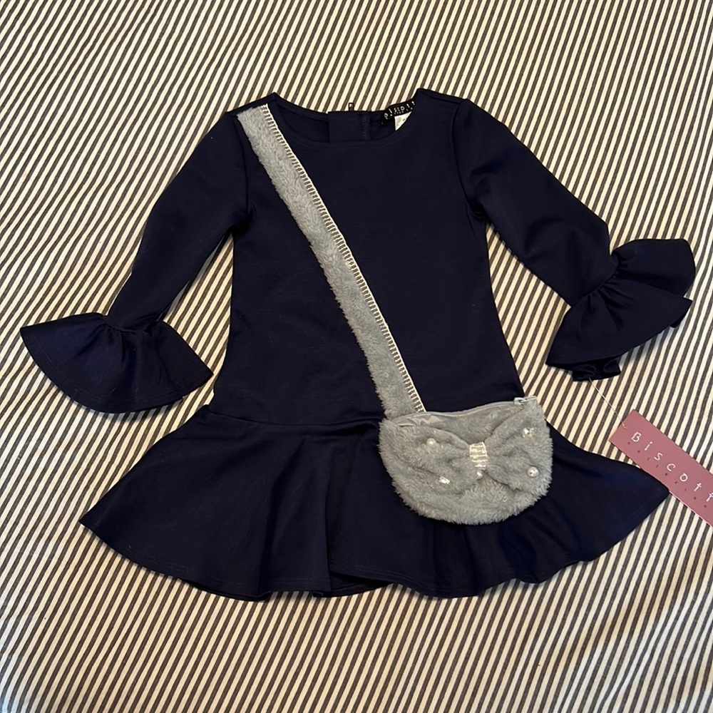 Super cute long sleeve dress size 2T with attached usable purse. NWT